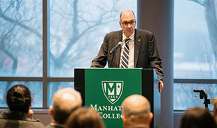 A man giving a speech. Links to What to Give